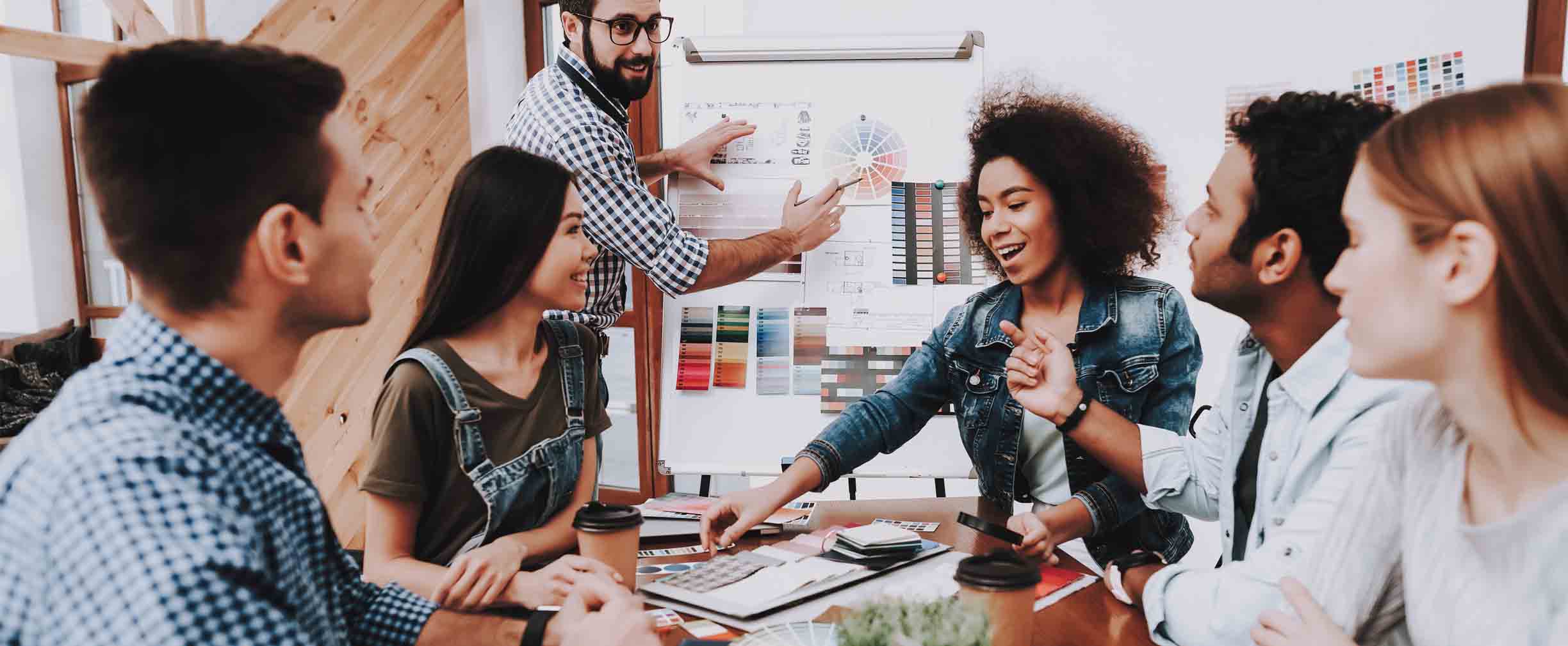 group of young professionals in a meeting at work