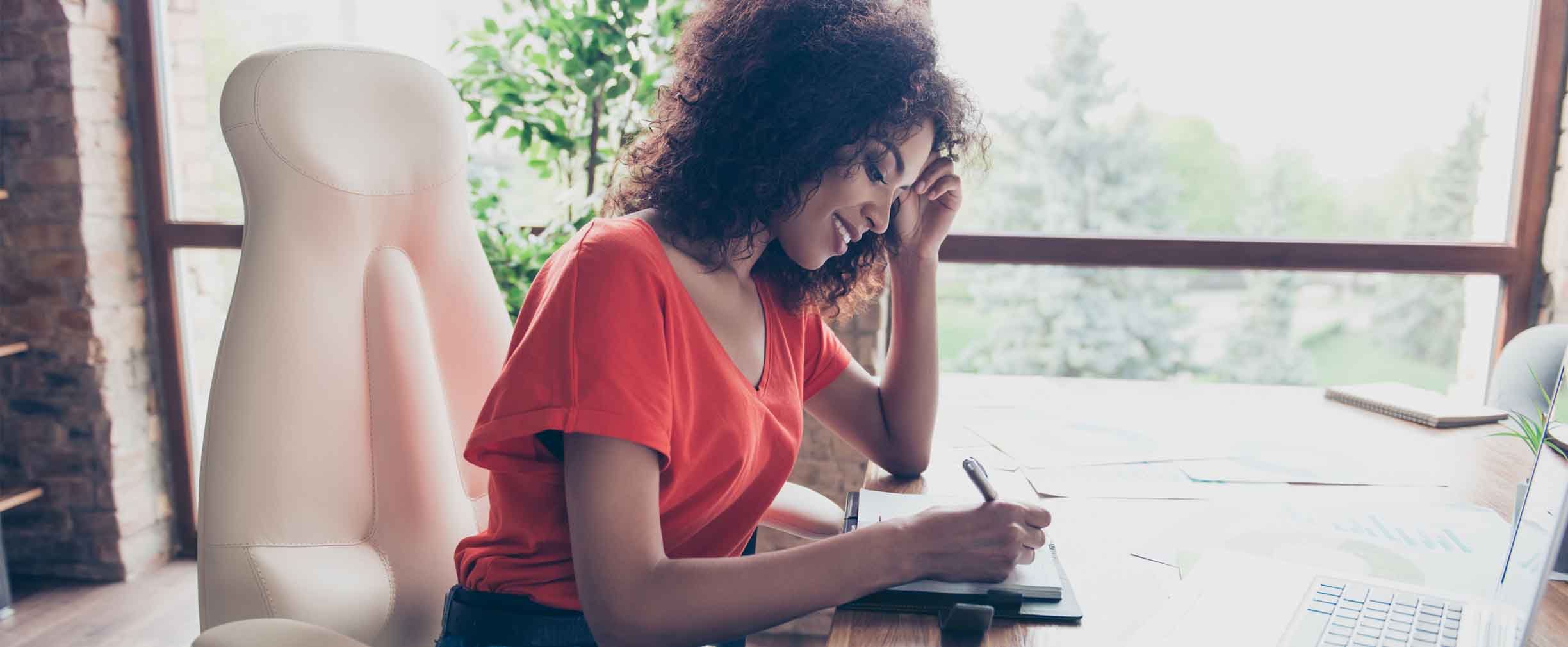 female young professional working at her desk