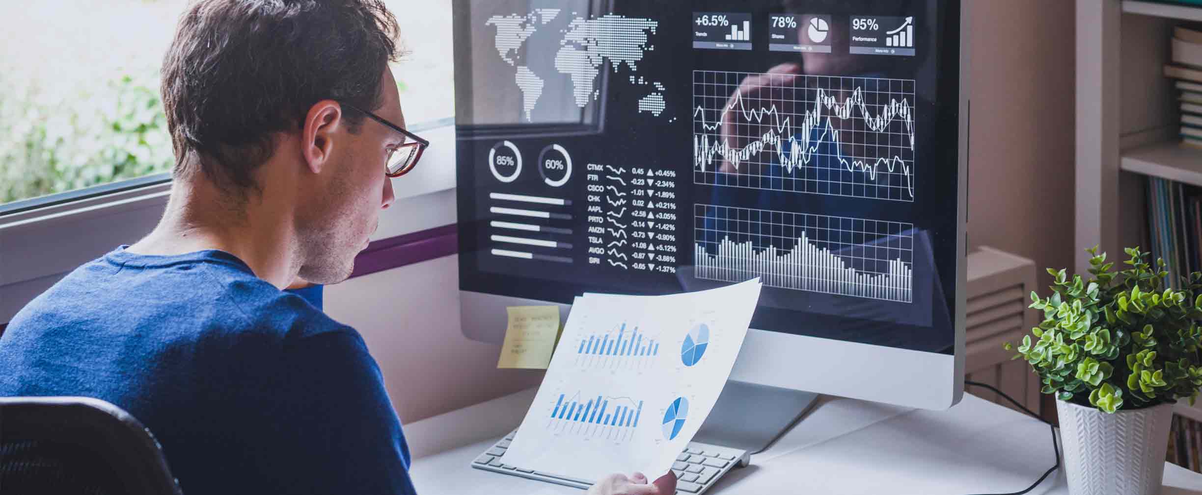 man reviewing financial statements and investments